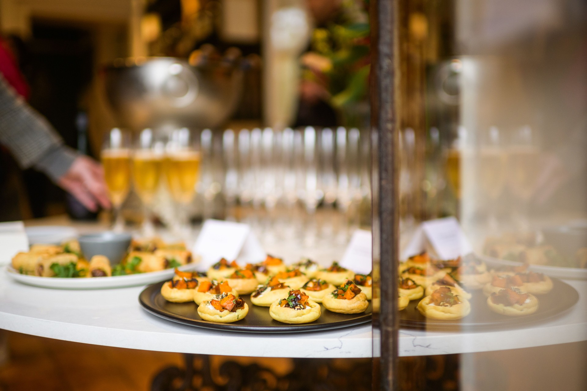 Assorted canapés served during a festive wine and champagne tasting event